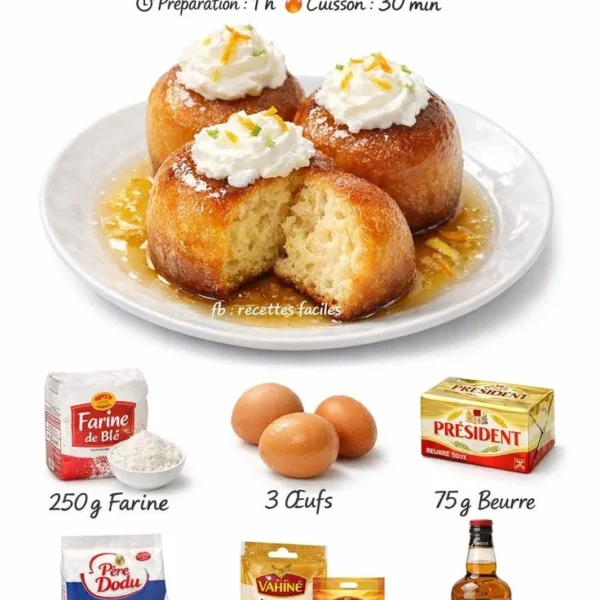 Baba au rhum traditionnel garni de crème et fruits
