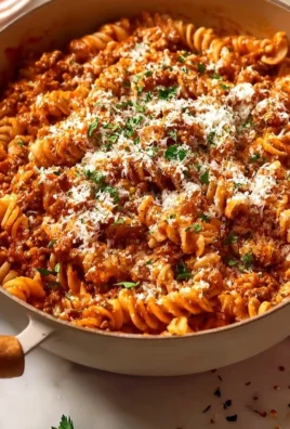 Delicious beef pasta served with fresh herbs and cheese