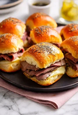 Buttery Italian roast beef Hawaiian roll sliders served on a platter