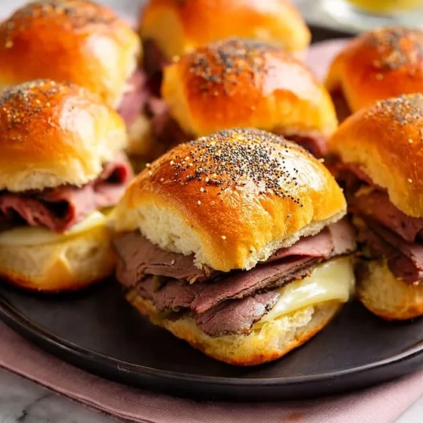 Buttery Italian roast beef Hawaiian roll sliders served on a platter
