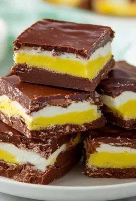 Delicious Cadbury Egg Fudge squares topped with chocolate.