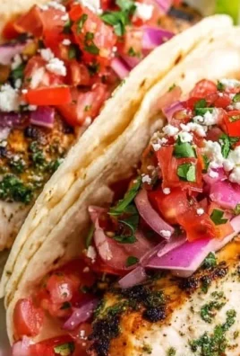 Cilantro Lime Grilled Chicken Tacos served on a platter with fresh toppings