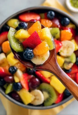 Citrus fruit salad with vibrant fruits and honey lime dressing served in a bowl