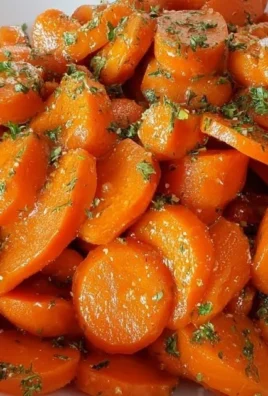 Crockpot Honey Maple Glazed Carrots served in a bowl, showcasing their vibrant color and glaze.