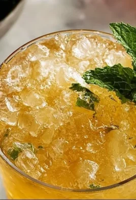 Refreshing homemade honey mint julep cocktail with fresh mint leaves