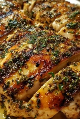 Delicious Lemon Greek Grilled Chicken served with fresh herbs and lemon slices.
