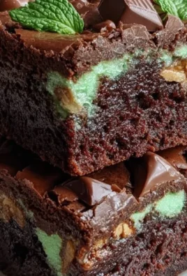 Delicious Mint Aero Brownies topped with mint chocolate pieces.