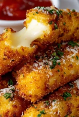 Delicious mozzarella sticks served with marinara sauce for dipping.