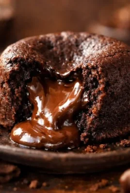 Delicious homemade Nutella Fondant dessert served with a chocolate drizzle