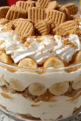 Delicious Nutter Butter trifle with layers of creamy filling and crushed cookies.