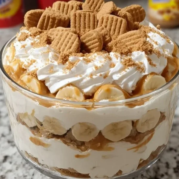 Delicious Nutter Butter trifle with layers of creamy filling and crushed cookies.