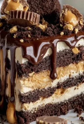 Slice of creamy Peanut Butter Icebox Cake with chocolate drizzle on top