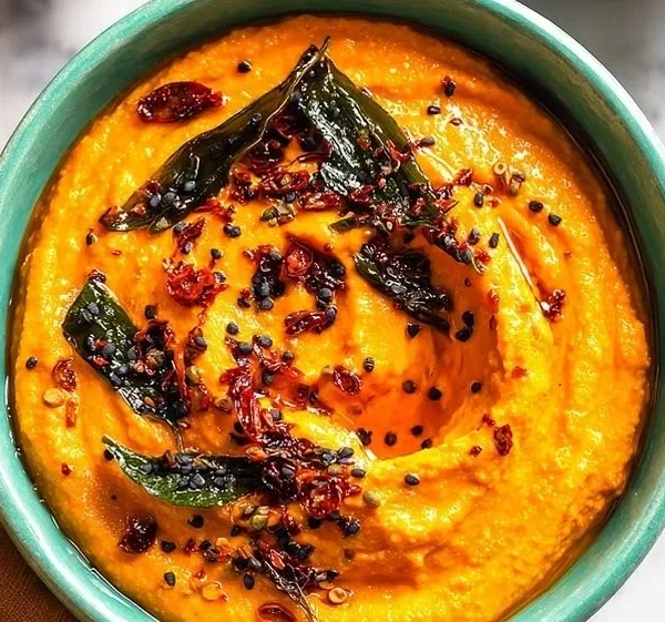 Delicious homemade radish chutney in a bowl, garnished with fresh herbs.