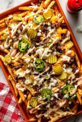 Delicious smash burger fries served with a side of condiments