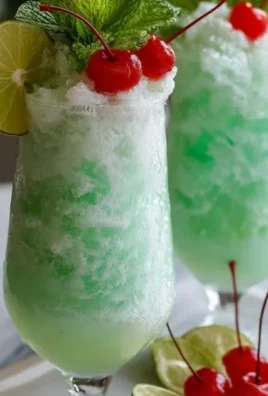 Delicious lime sherbet floats served in a chilled glass with soda.